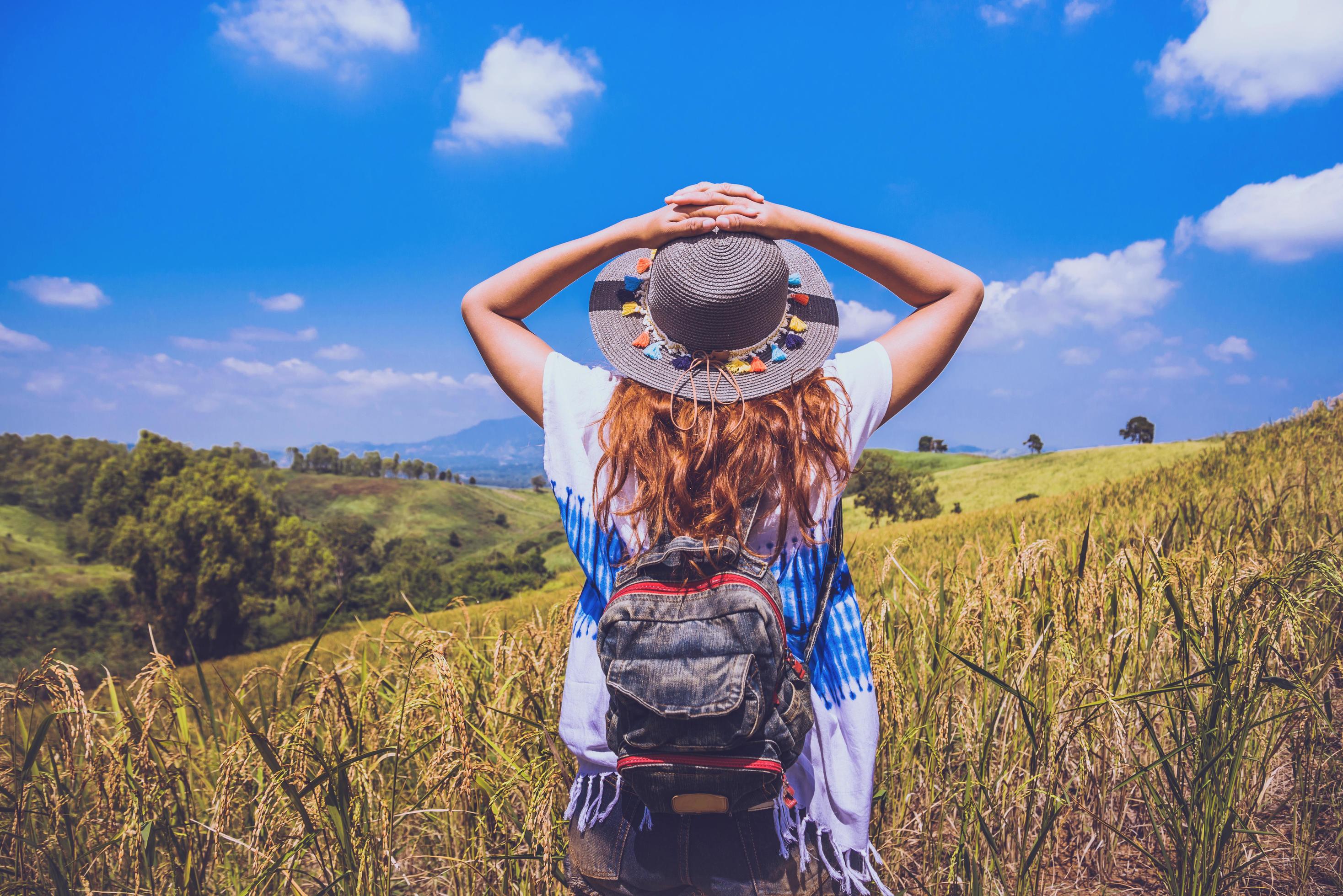 Asian women travel relax in the holiday. Stand natural touch mountain field. Thailand Stock Free