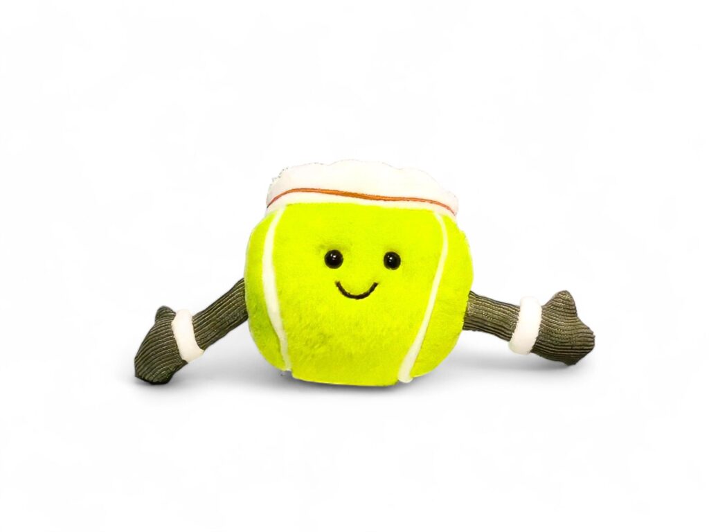 Cute doll tennis ball on white background Stock Free