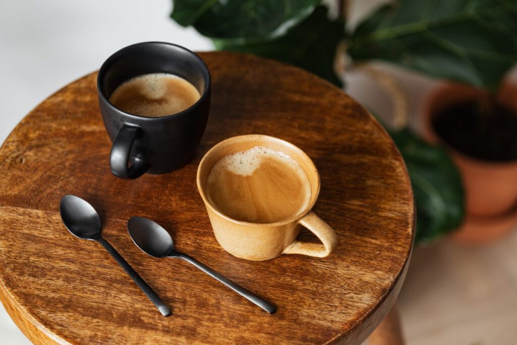 Cup of coffee on wooden table Stock Free