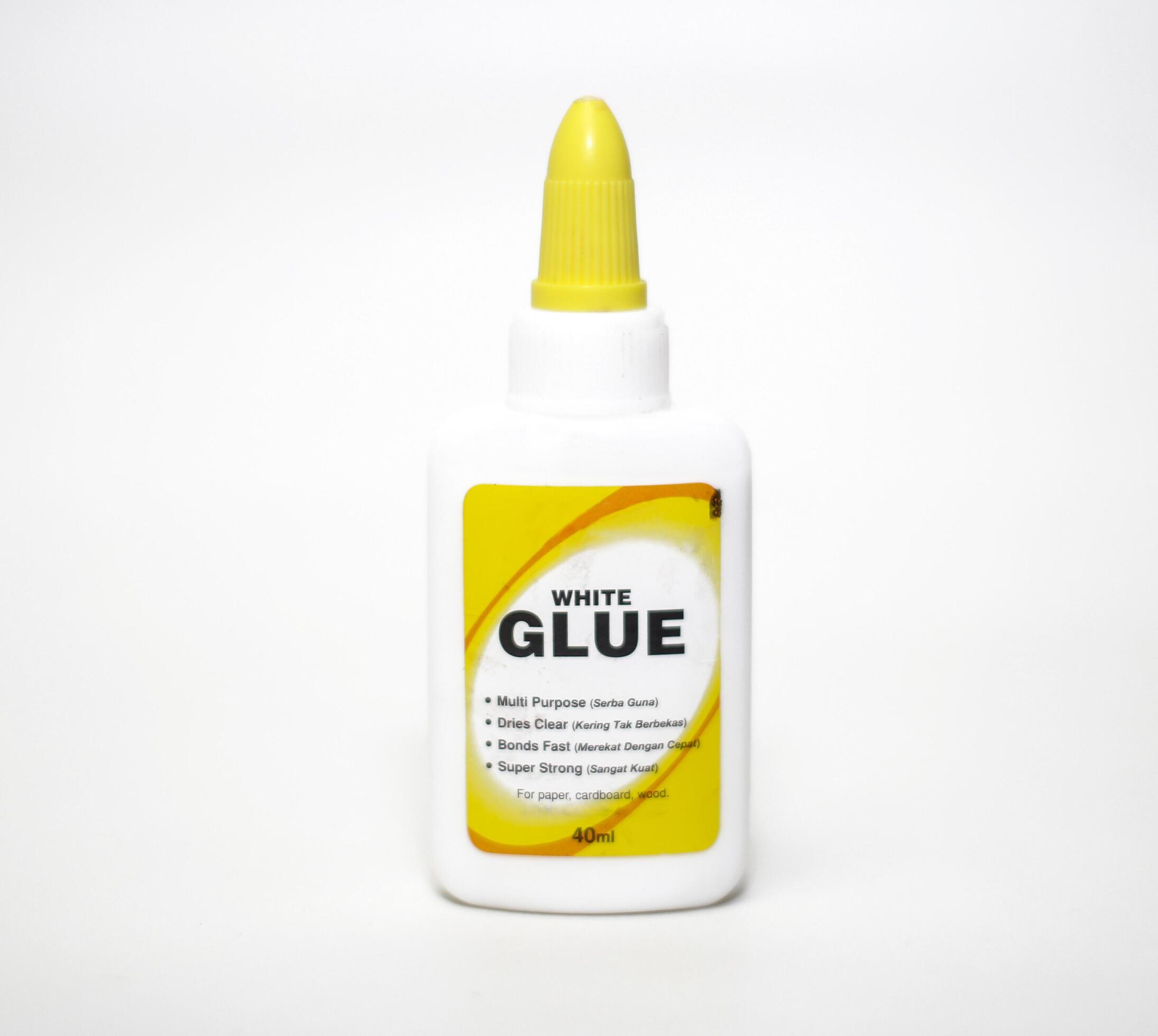 Bottle of white glue isolated on white background Stock Free