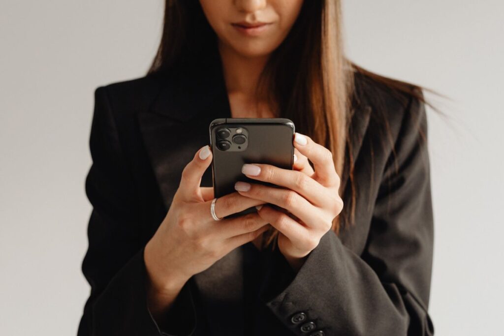 Dark Classy Aesthetic Fashion – Beautiful Asian Female Entrepreneur in Black Suit – Technology and Devices – iPhone – Laptop – AirPods Stock Free