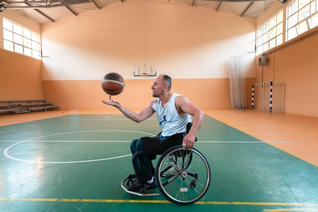 a photo of a war veteran playing basketball in a modern sports arena. The concept of sport for people with disabilities Stock Free