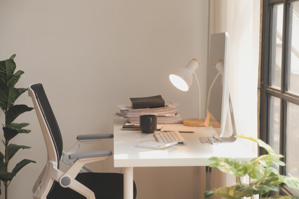 messy office workspace. Messy and cluttered office desk. Messy business office with piles of files and disorganized clutter. Stock Free