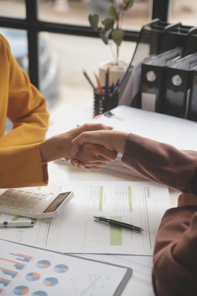 Teamwork executives colleagues business people handshake after meeting Stock Free