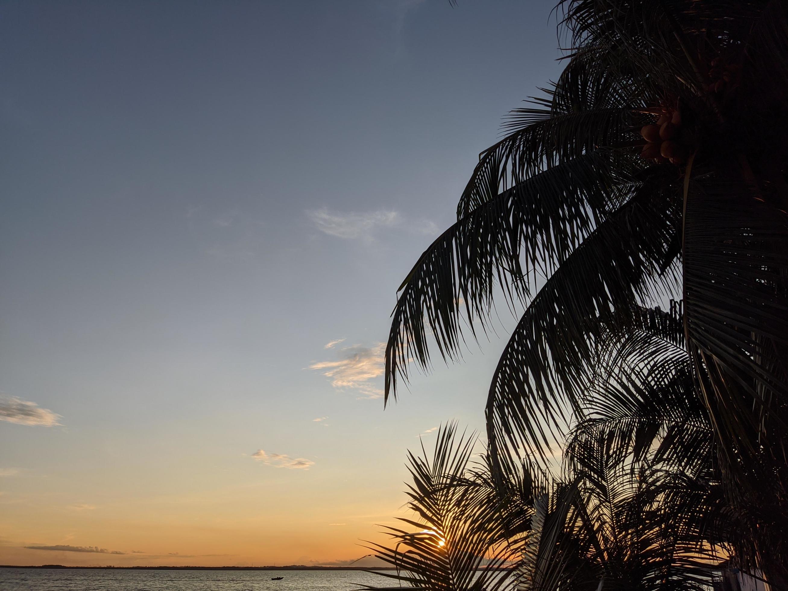 the view of the natural phenomenon of sunset on a beautiful beach Stock Free