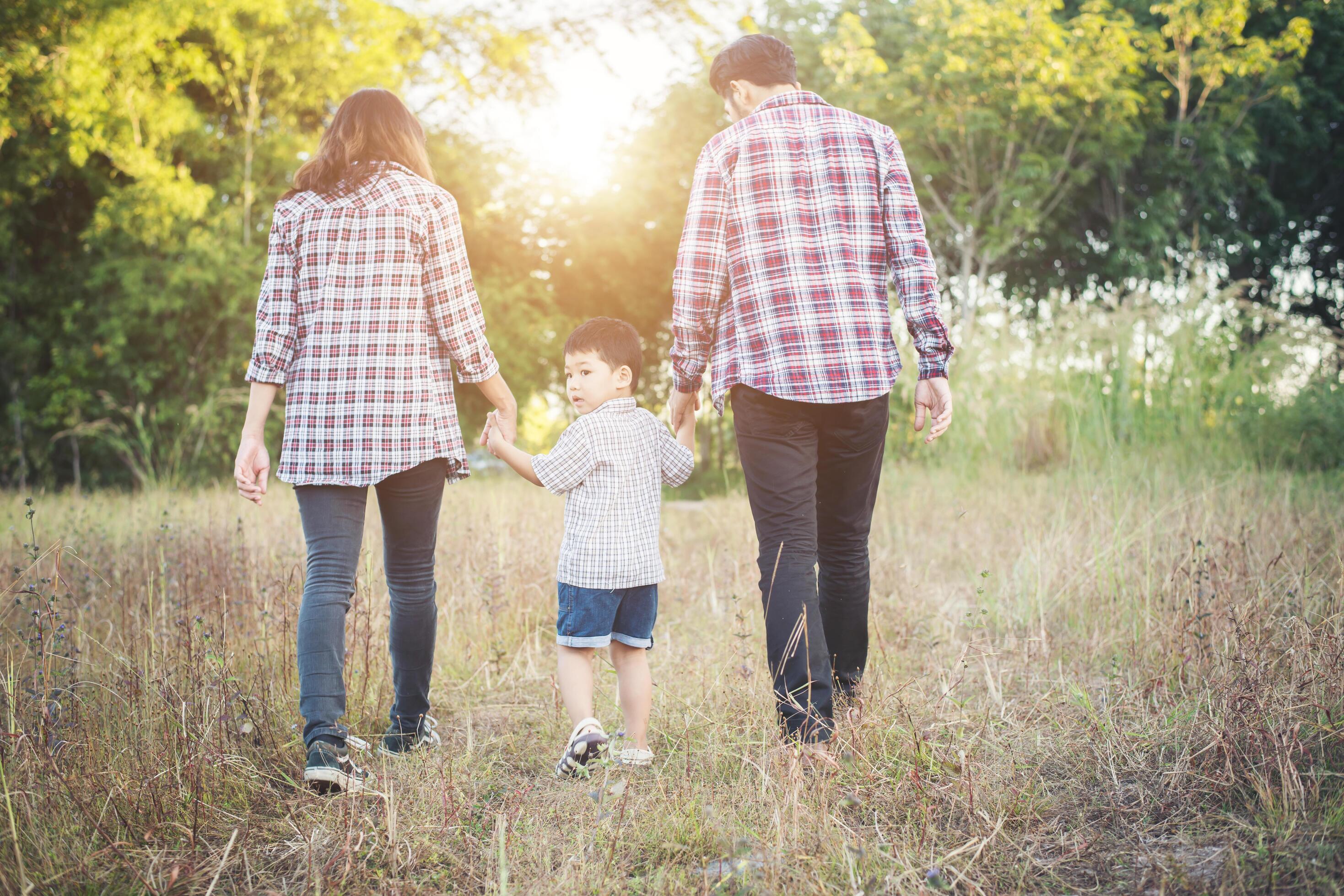 Young family spending good time together. Family outdoors in love. Stock Free