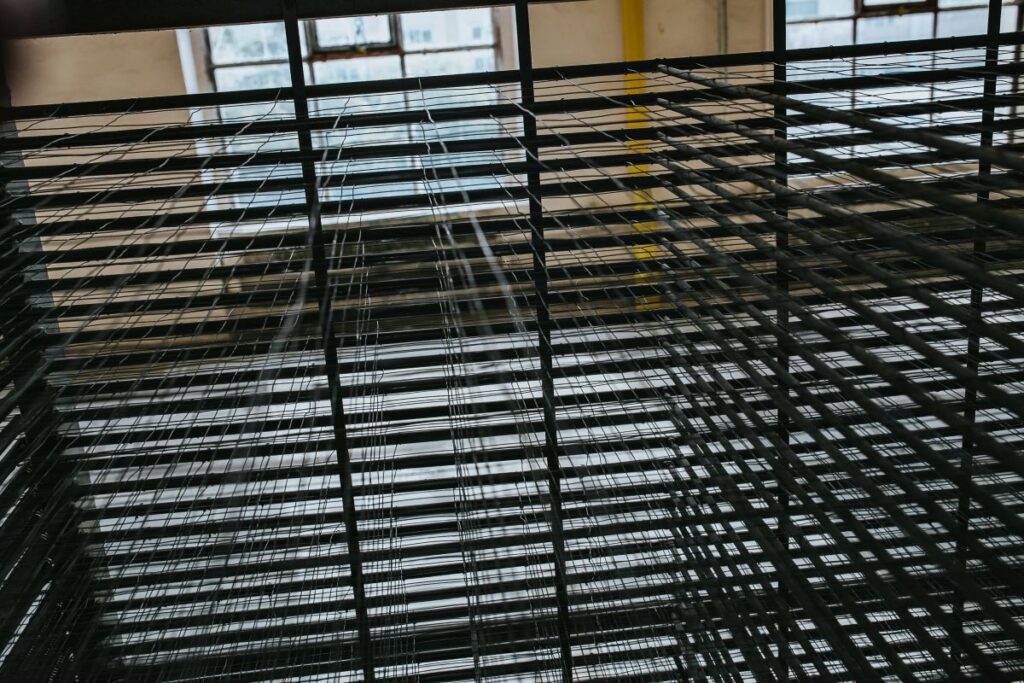 Interior of an abandoned building hall with yellow pillars Stock Free