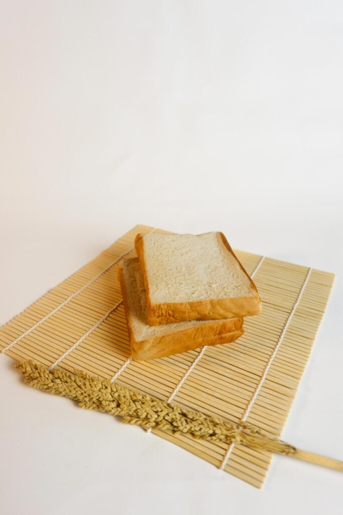 studio photography of bread and wheat on an isolated white background Stock Free