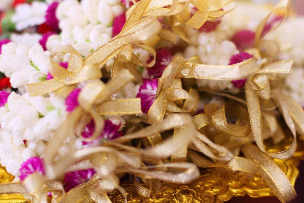 Flower garlands on a gold tray in tradition Thai wedding ceremony day. Jasmine garland Stock Free