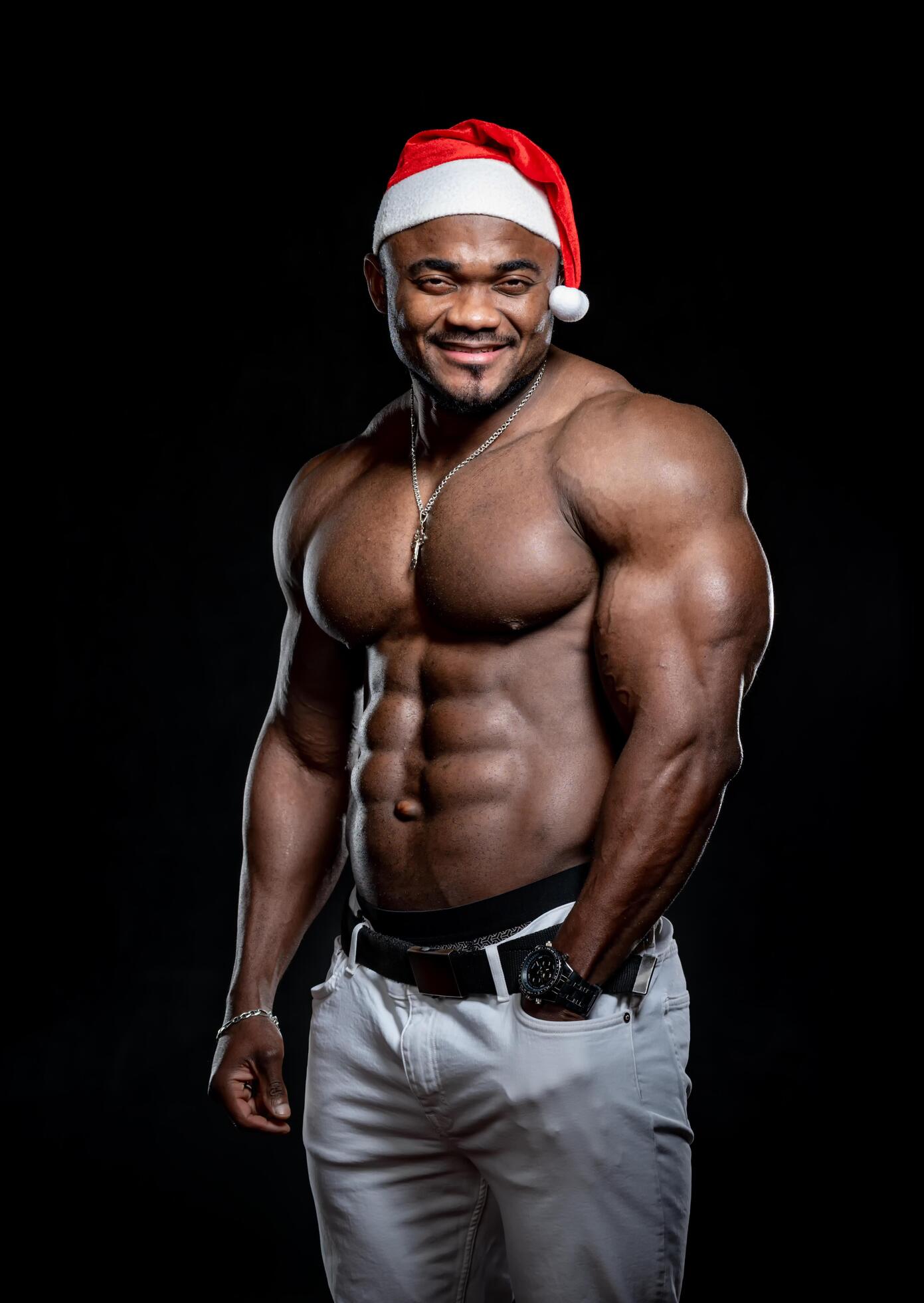 Sexy shirtless muscular man on dark background. Young strong macho. Stock Free