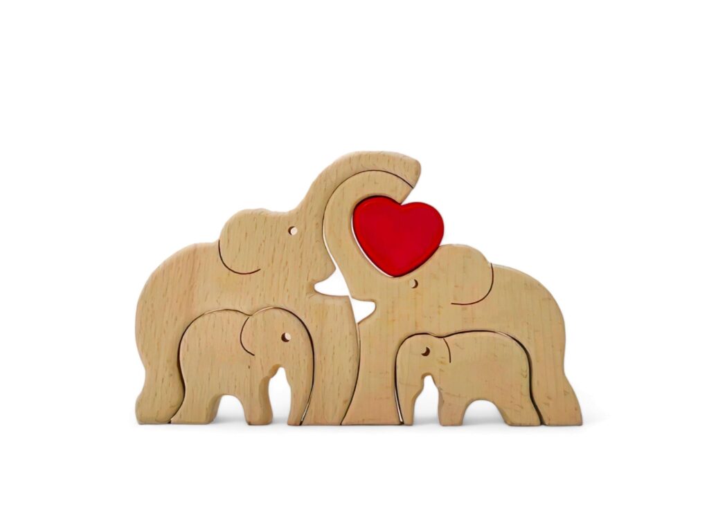 miniature elephant family decoration made of wood on a white background Stock Free