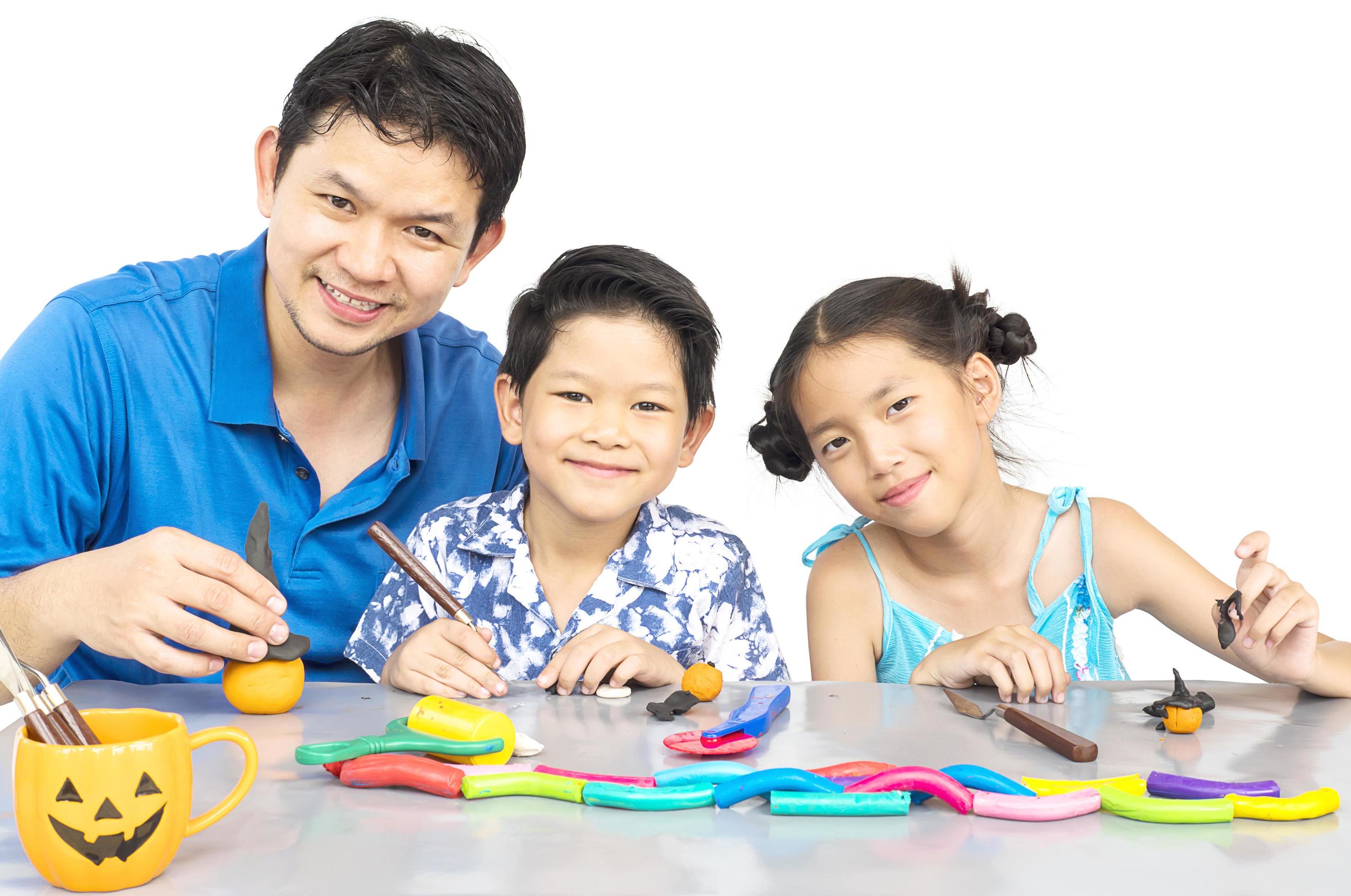 Father is playing clay toy with kid Stock Free