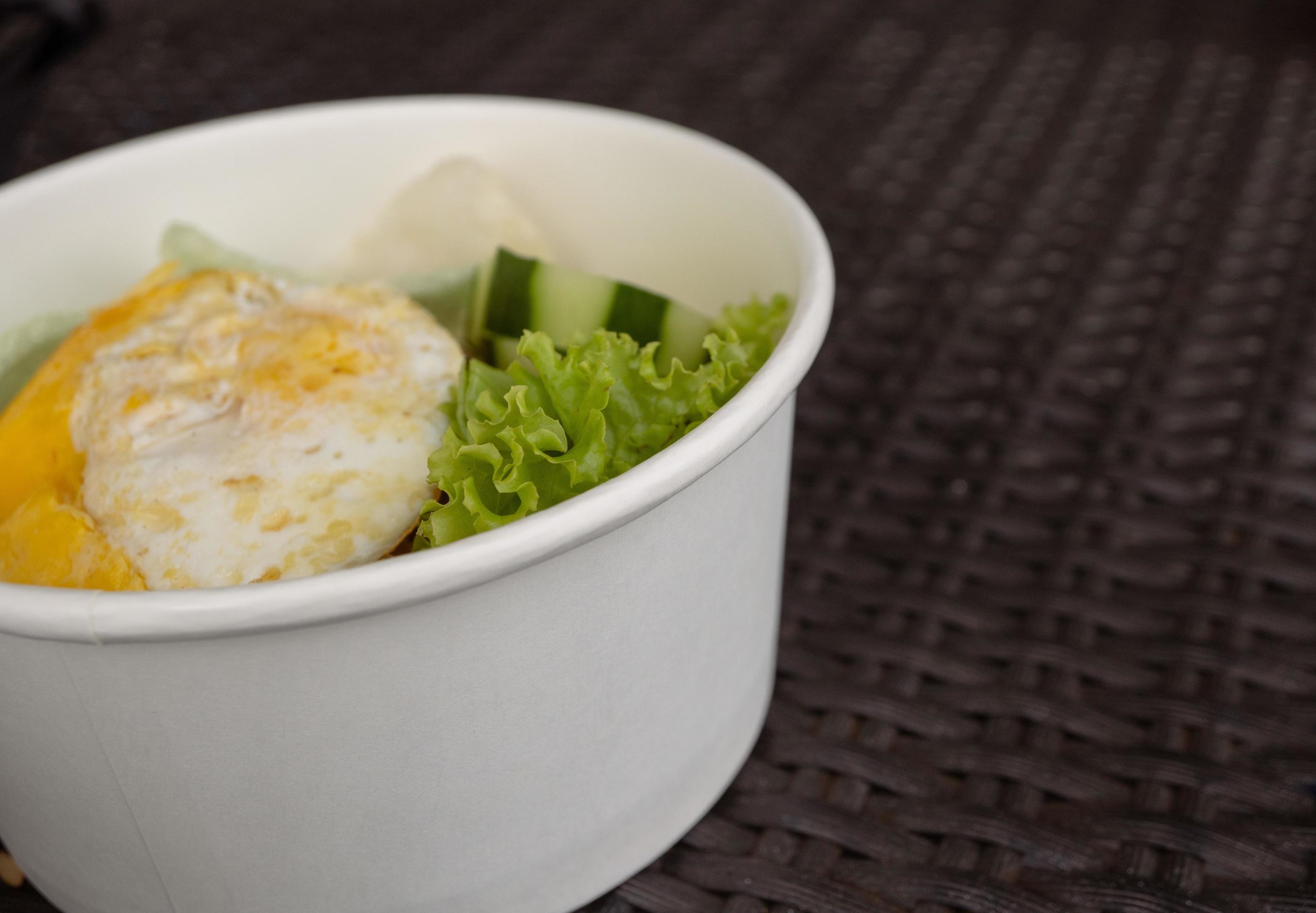 Close up photo fried rice with eggs and lettuce. The photo is suitable to use for traditional food background, poster and food content media. Stock Free