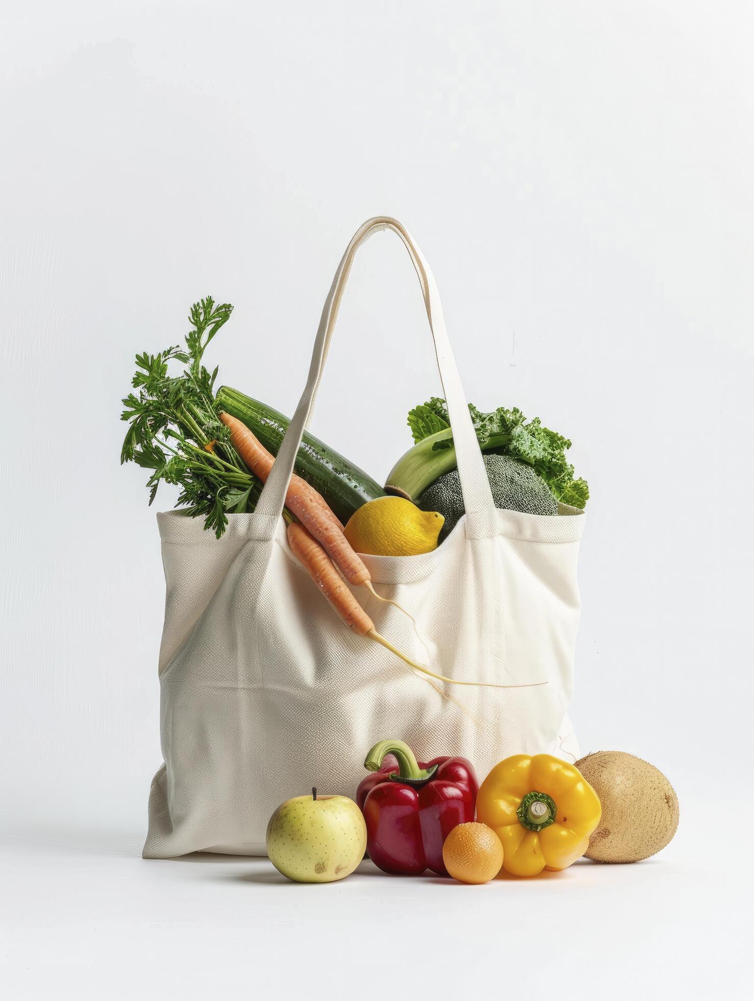 Eco bag with fruits and vegetables on a white background Stock Free