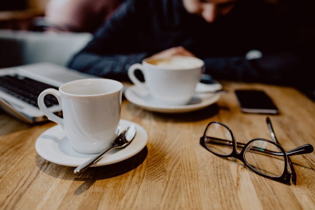 Cup of coffee on table in cafe Stock Free