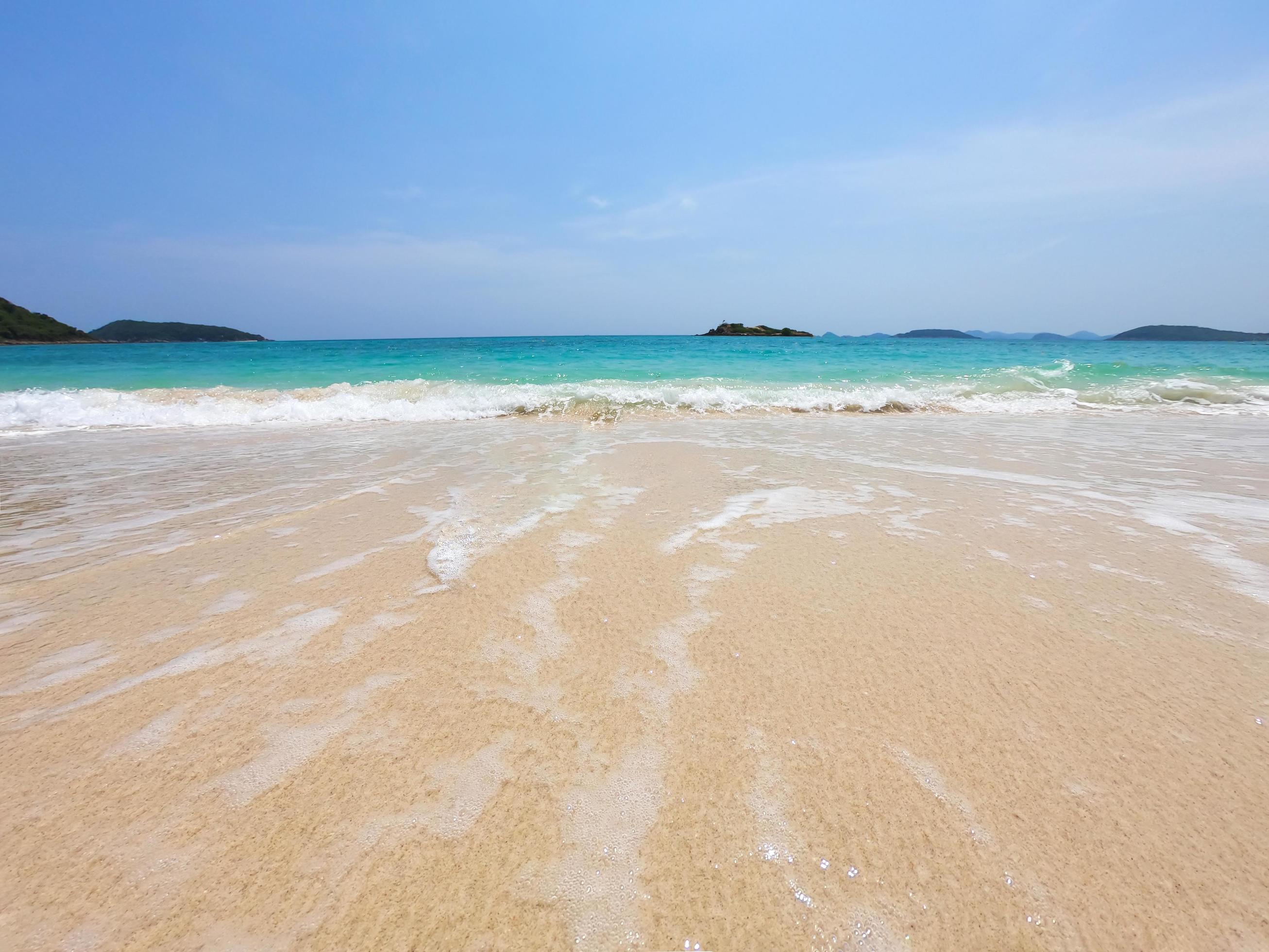 Bright clean sea sand sun beach with blue sky landscape – sea beach nature background concept Stock Free