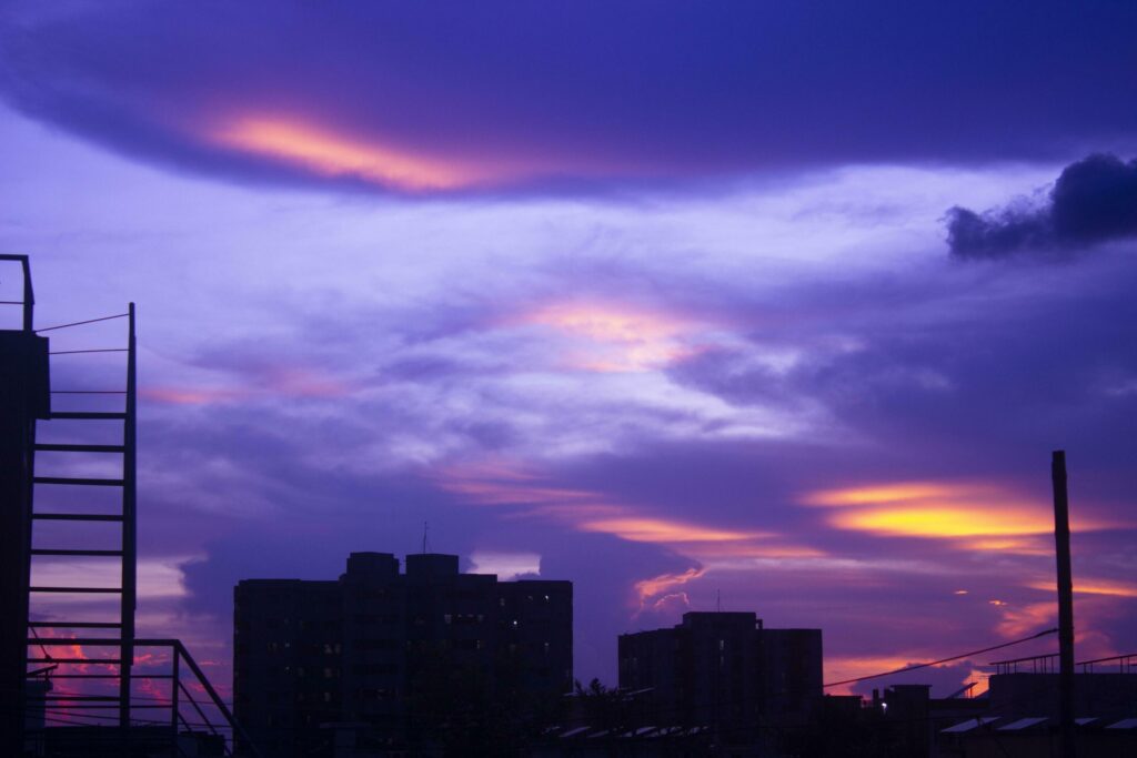 Colorful sunset with clouds in the evening Stock Free