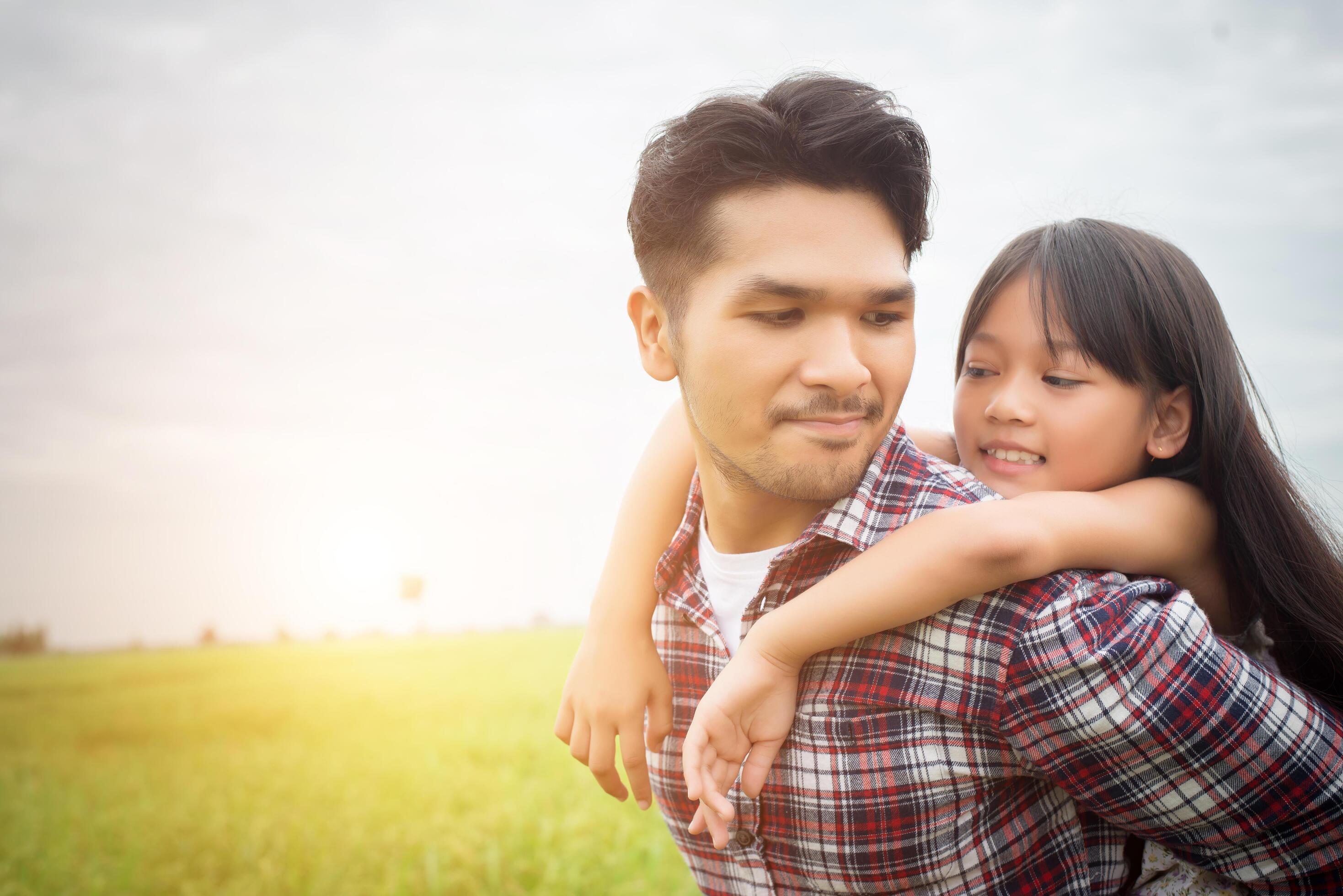 Hipster Father and daughter playing outdoor at summer sunrise. Stock Free