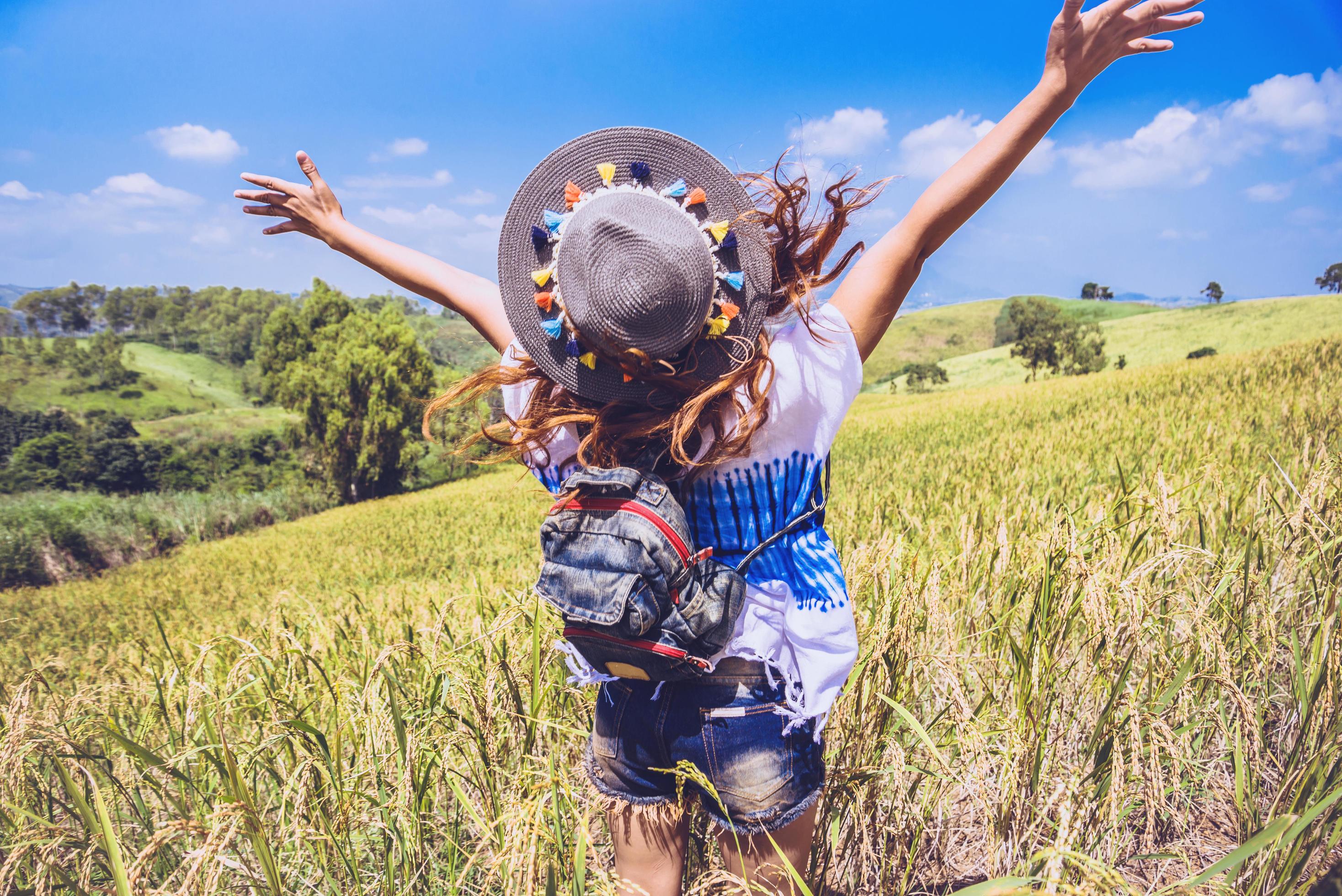 Asian women travel relax in the holiday. Stand natural touch mountain field. Thailand Stock Free