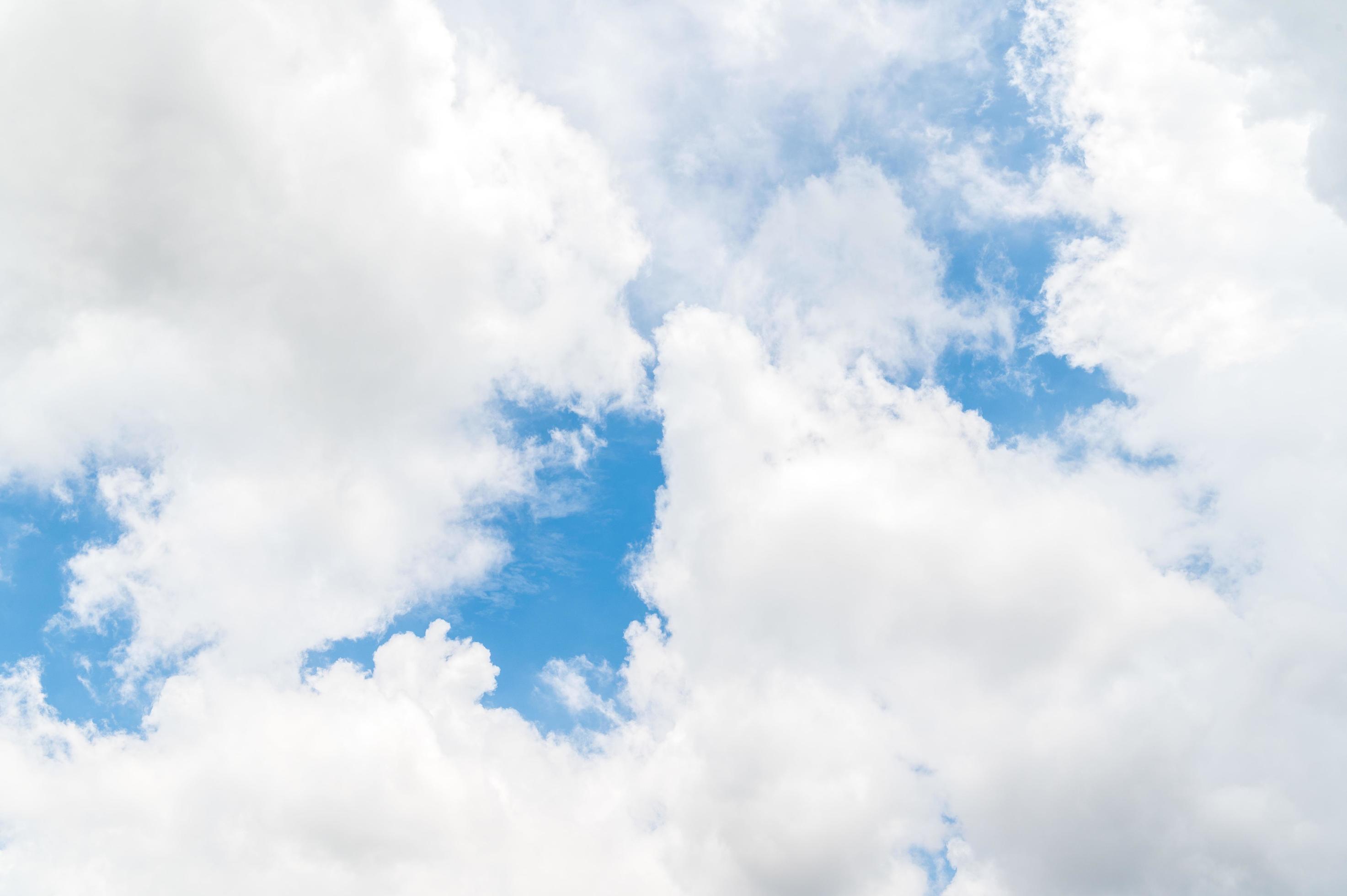 Beautiful white fluffy clouds in blue sky. Nature background from white clouds in sunny day Stock Free