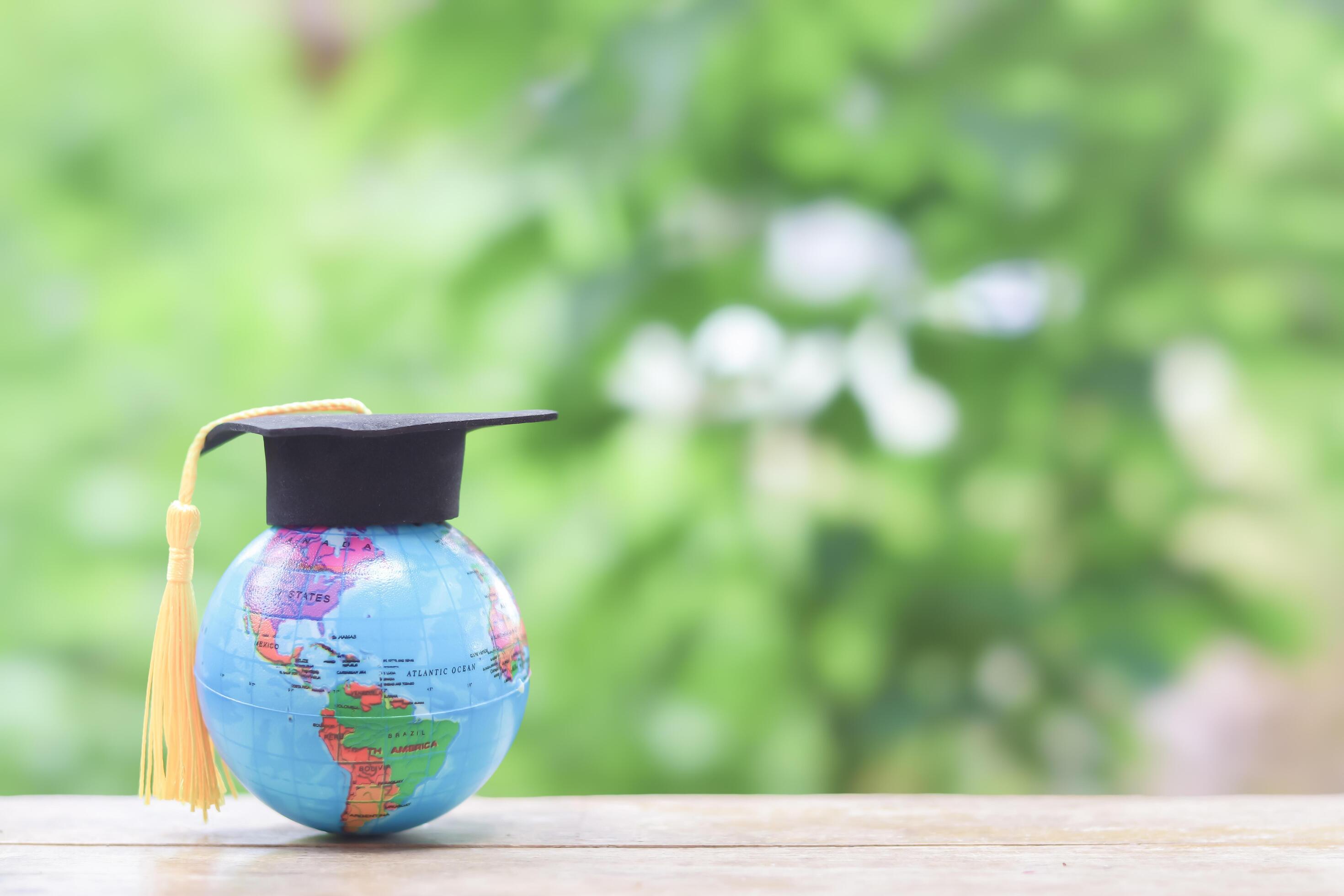 Earth globe with graduation hat. Copy space for text, Back to school, Education concept Stock Free