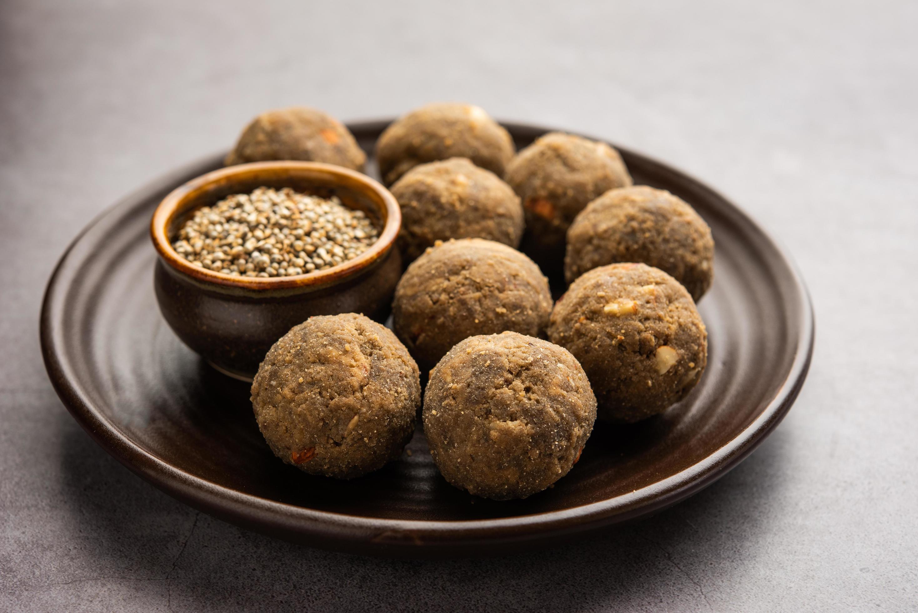 Bajra Atta Ladoo or kuler laddoo – Millet Flour Laddu, a popular winter sweet snack food from India Stock Free