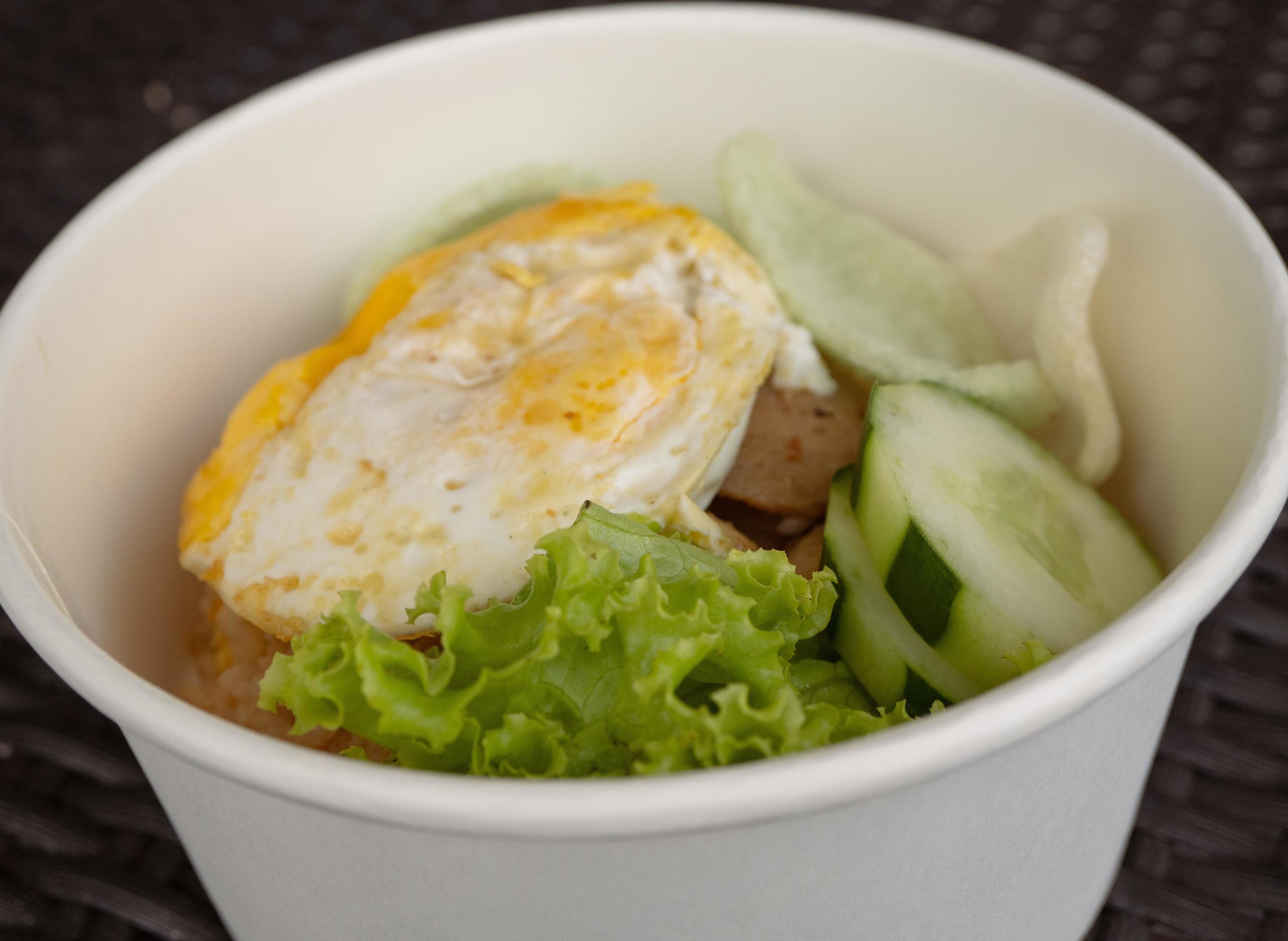 Close up photo fried rice with eggs and lettuce. The photo is suitable to use for traditional food background, poster and food content media. Stock Free