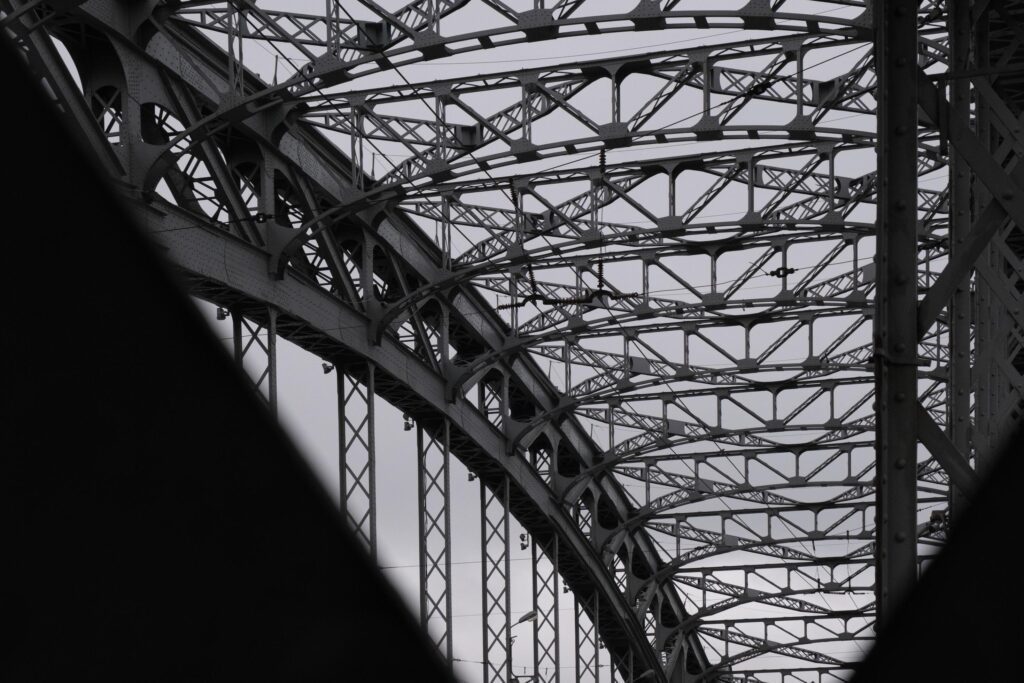 The architecture of the city bridge over the river during the daytime. Stock Free