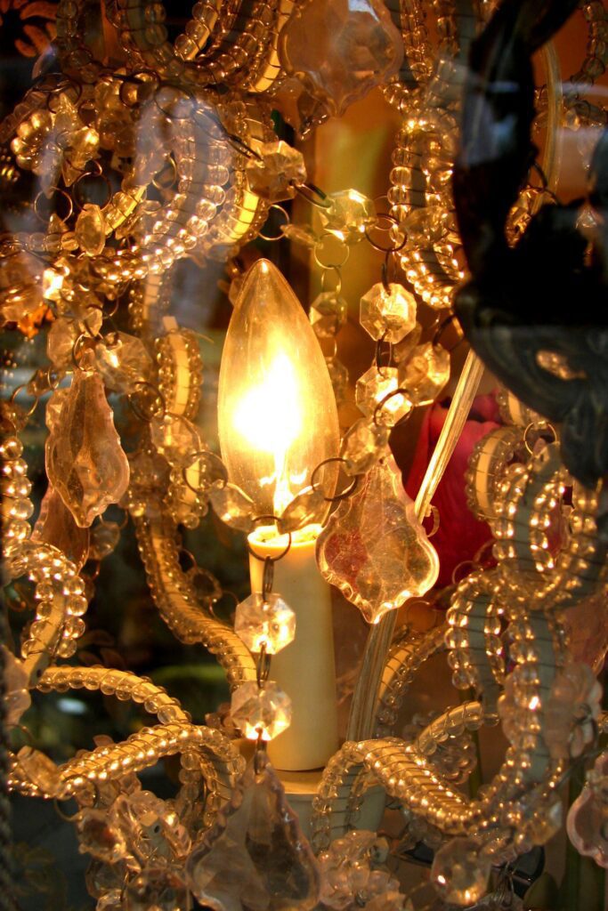 Chandelier closeup with candle-flame bulb Stock Free