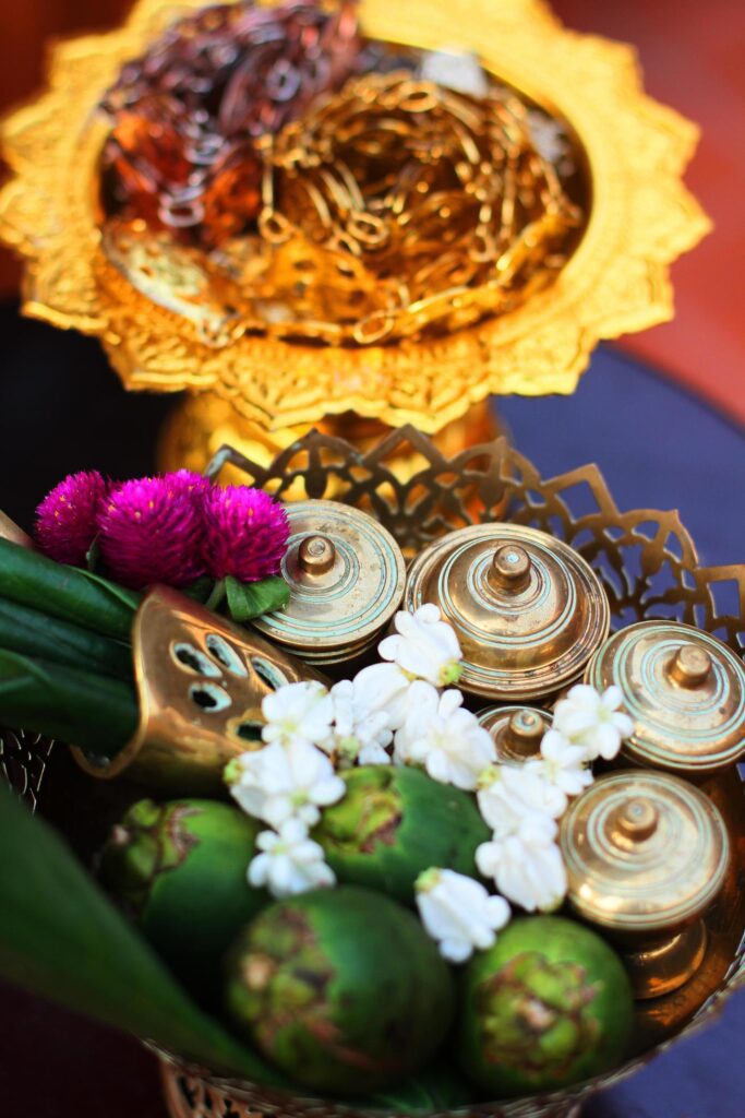 Silver and Gold Thai accessory, Green betel nuts and Marigold flowers on golden tray for Wedding ceremony in Thailand traditional Stock Free