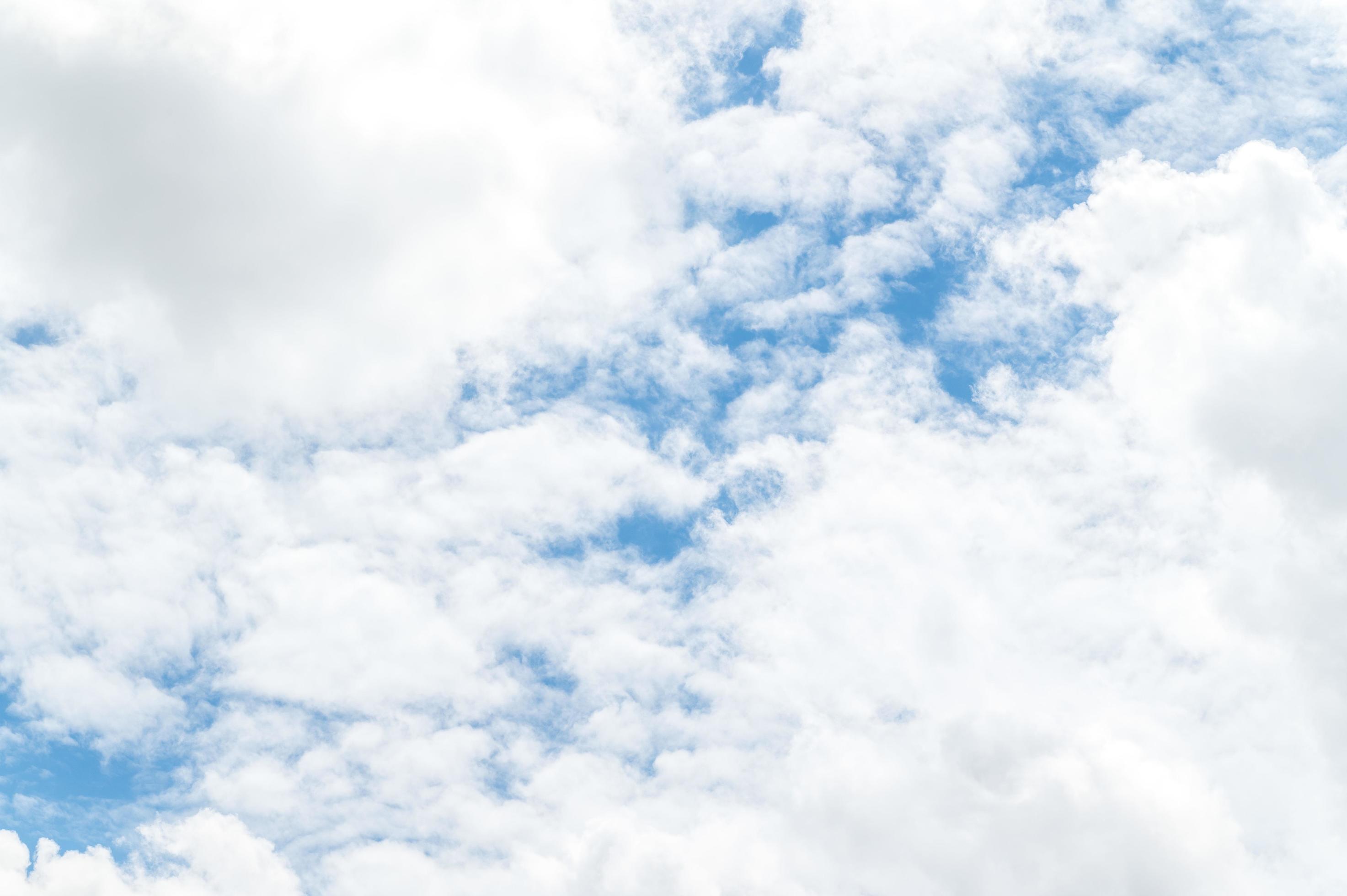 Beautiful white fluffy clouds in blue sky. Nature background from white clouds in sunny day Stock Free