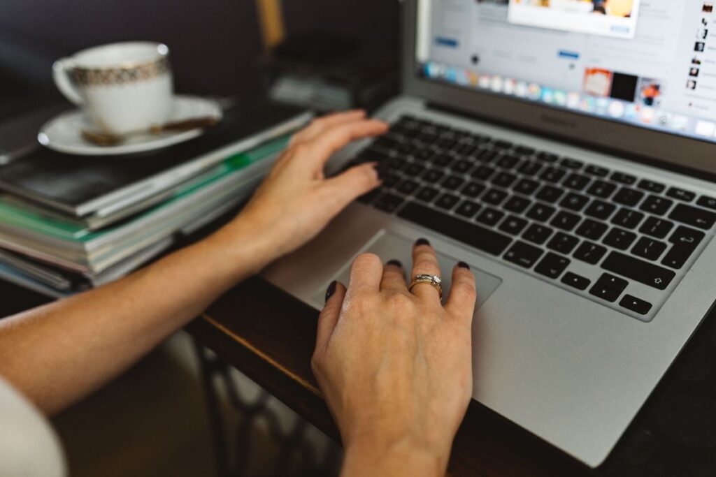 Woman working on laptop at home office Stock Free