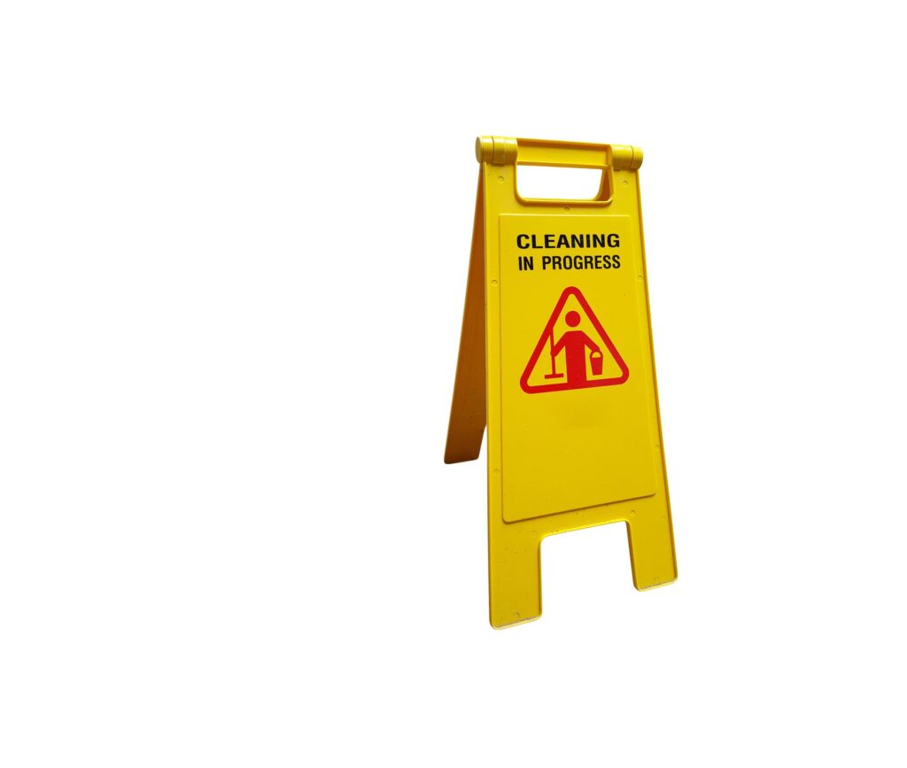 A cut-out of a yellow caution wet floor sign on a white background with clipping paths. Stock Free