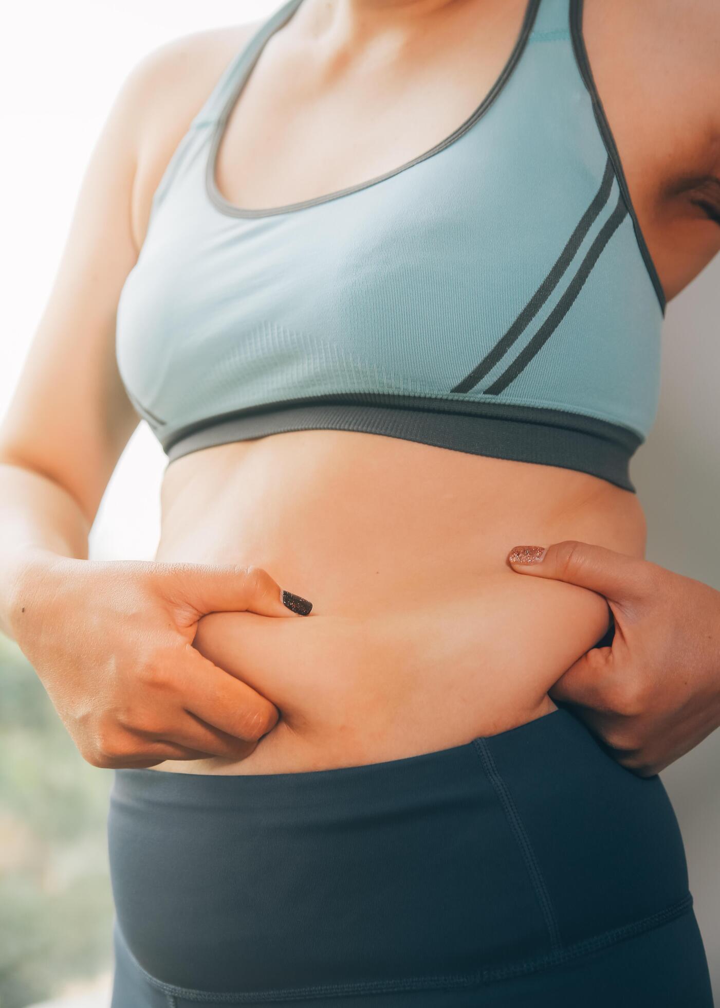 fat woman, fat belly, chubby, obese woman hand holding excessive belly fat with measure tape, woman diet lifestyle concept Stock Free