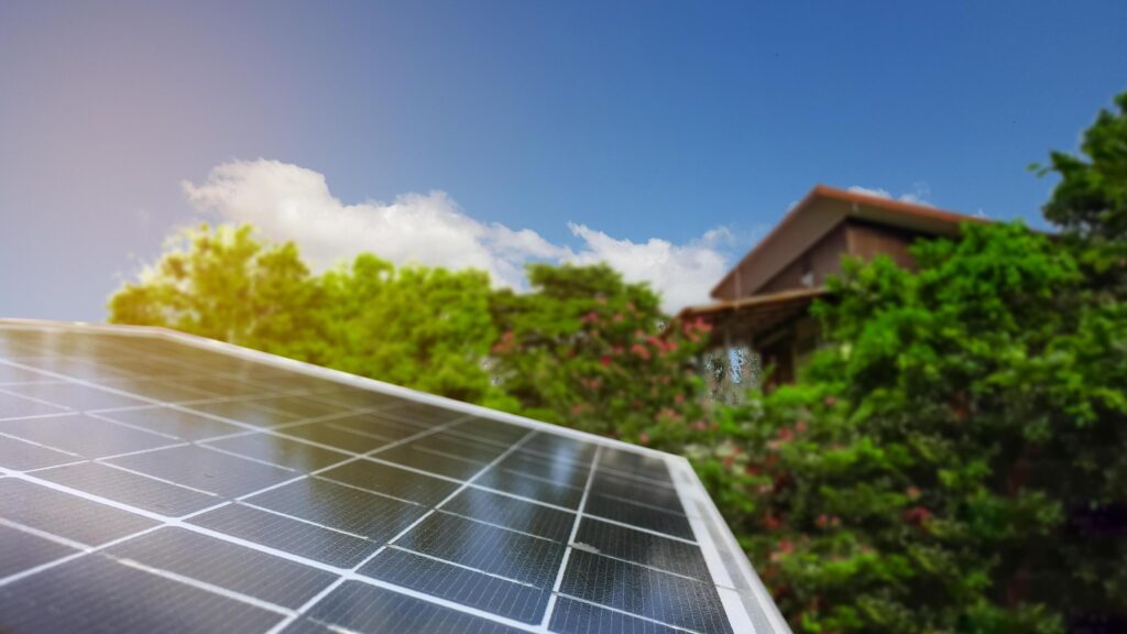 Solar panels set against a blurred background, emphasizing the concept of using solar energy for homes in remote areas. Stock Free