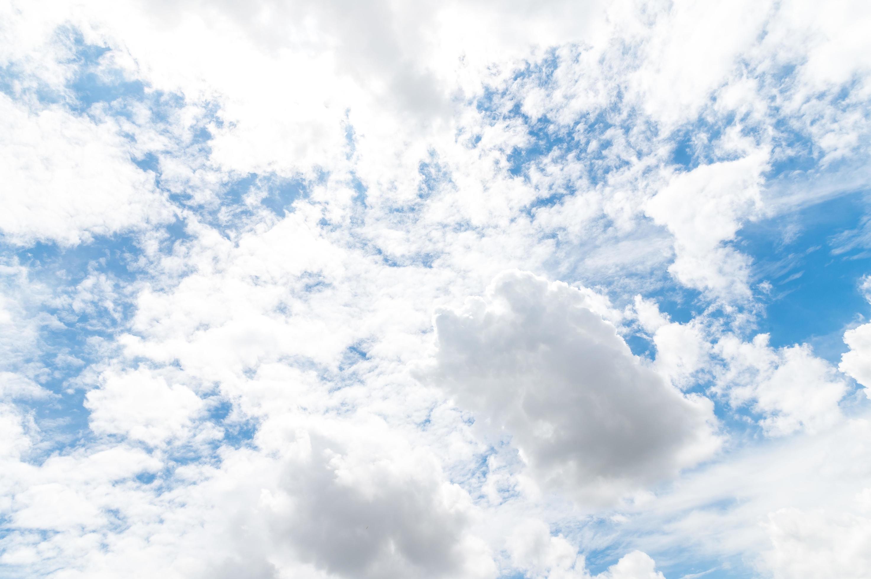 Beautiful white fluffy clouds in blue sky. Nature background from white clouds in sunny day Stock Free