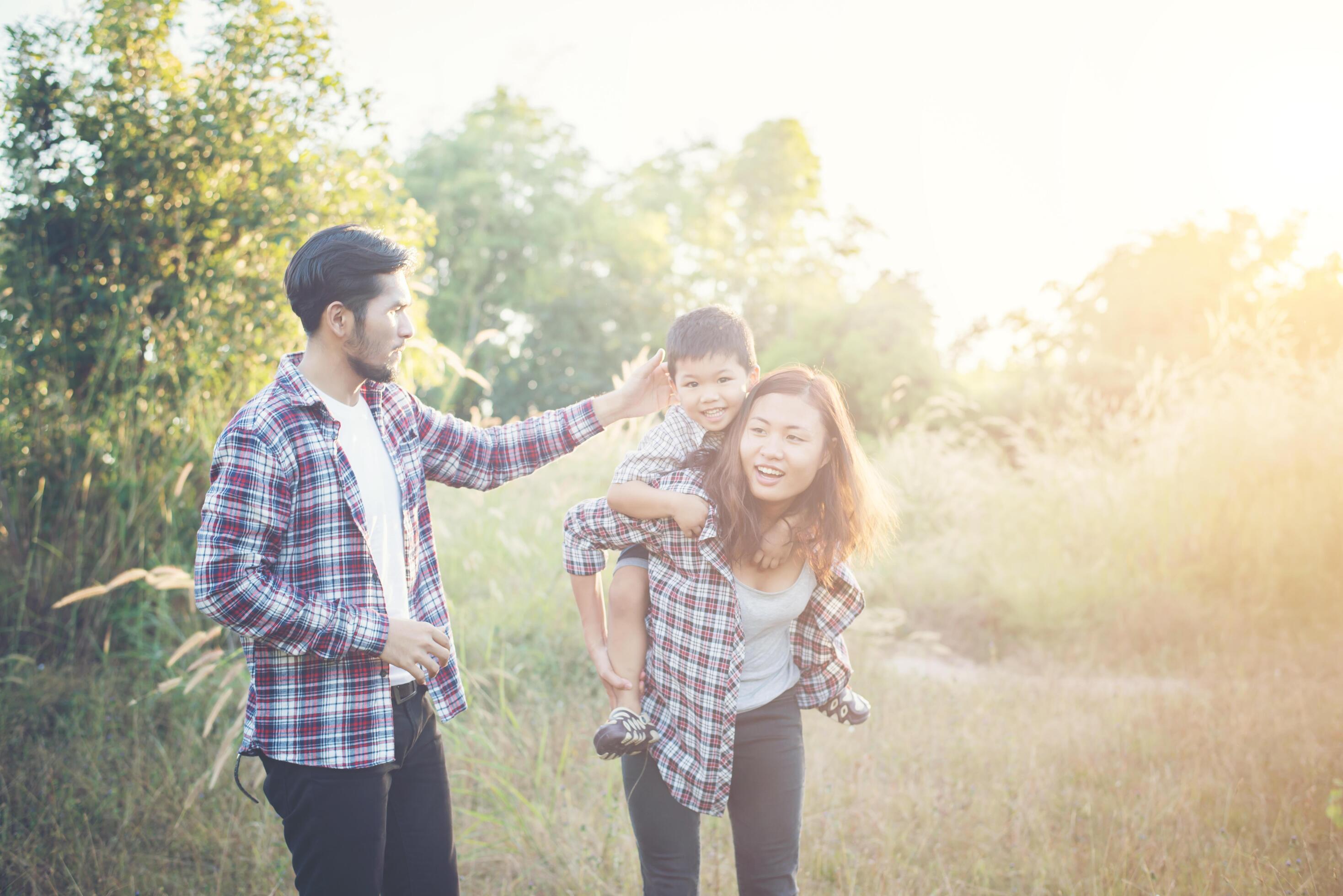 Happy young family spending time together outside. Family love concept Stock Free