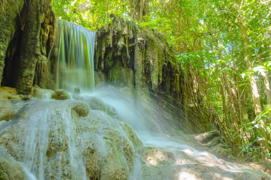 Deep forest waterfall in erawan national park kanchanaburi ,Thailand nature travel Stock Free