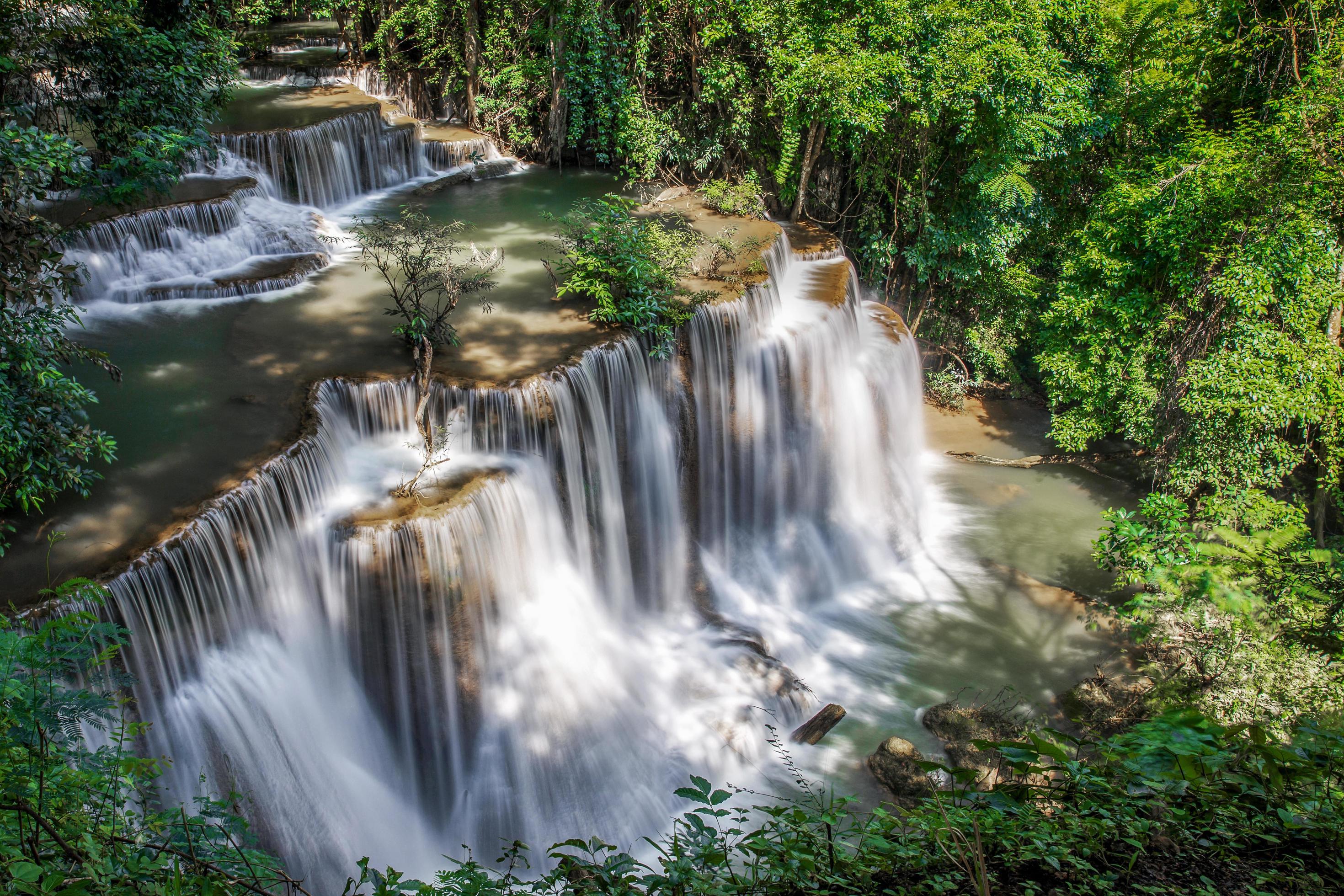 Beautiful waterfall nature scenery of deep forest in summer day Stock Free