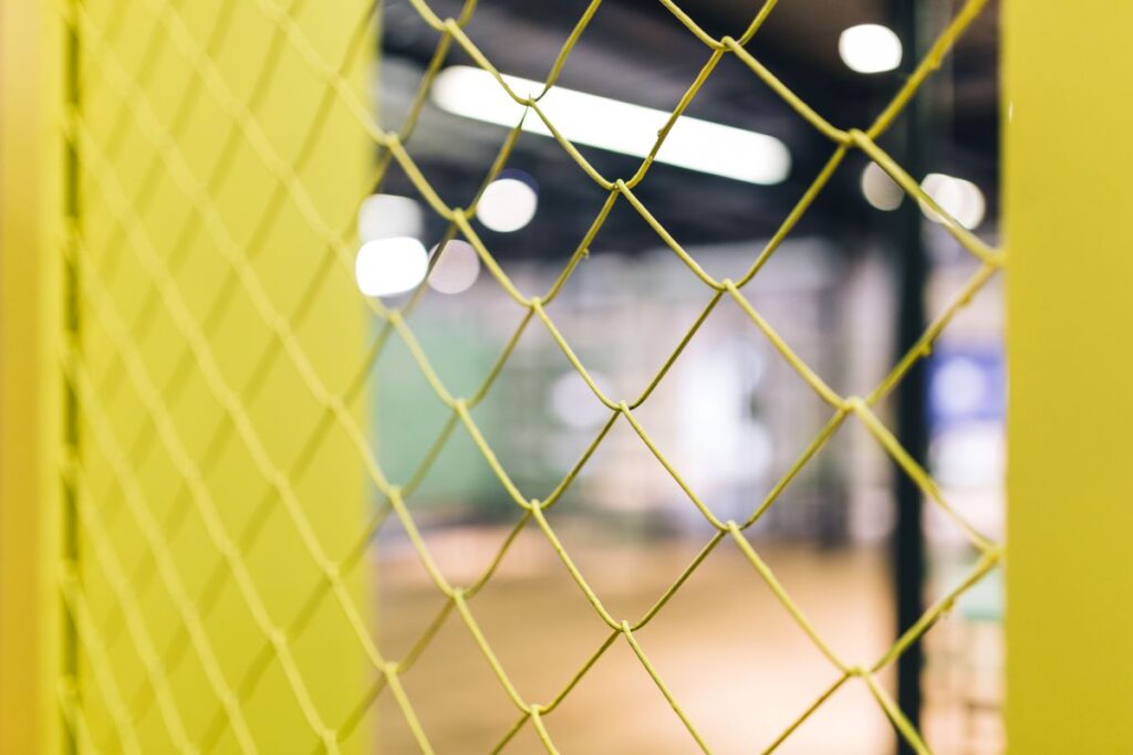 Close-ups of yellow wire netting Stock Free