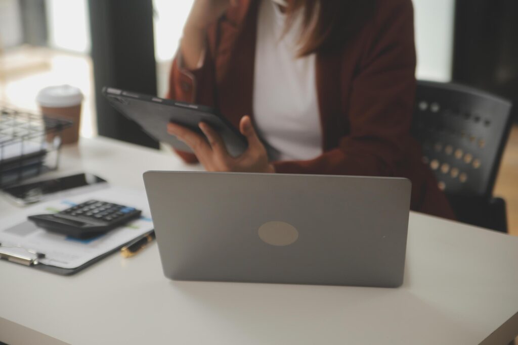 Shot of a asian young business Female working on laptop in her workstation. Stock Free