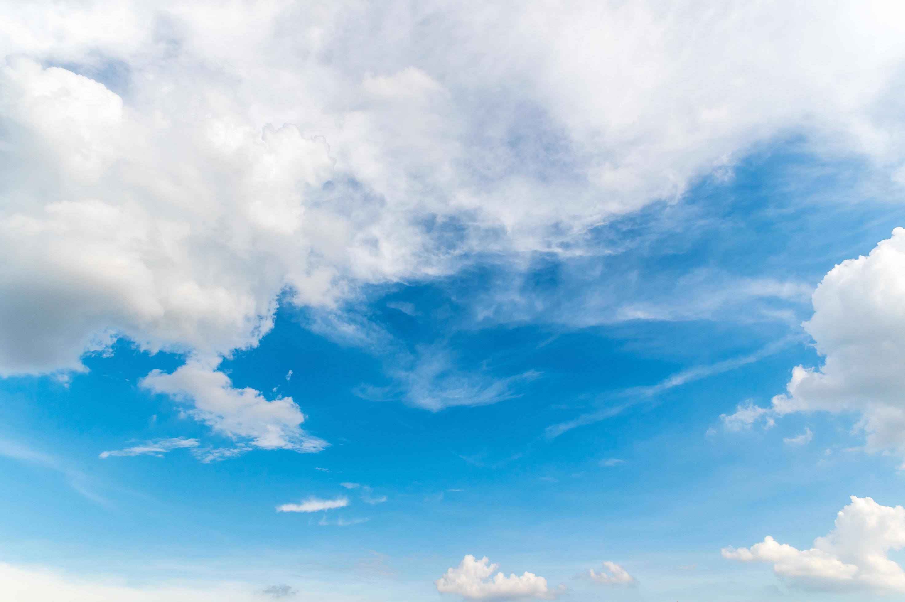 Beautiful white fluffy clouds in blue sky. Nature background from white clouds in sunny day Stock Free