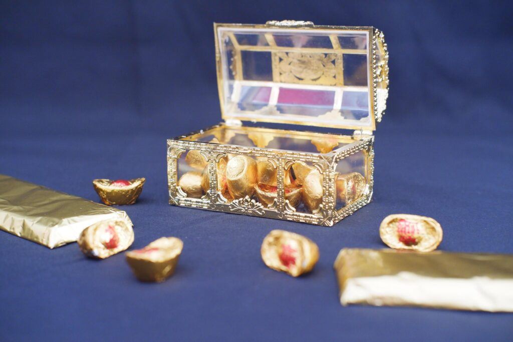 chinese gold chocolates on black background, chinese sweets Stock Free