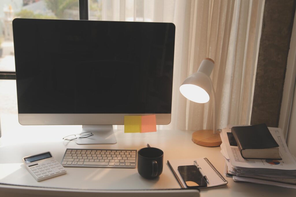 messy office workspace. Messy and cluttered office desk. Messy business office with piles of files and disorganized clutter. Stock Free