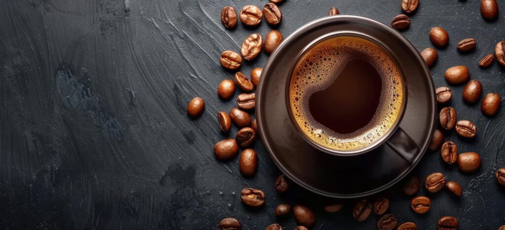 A Cup of Coffee With Coffee Beans on a Dark Background Stock Free