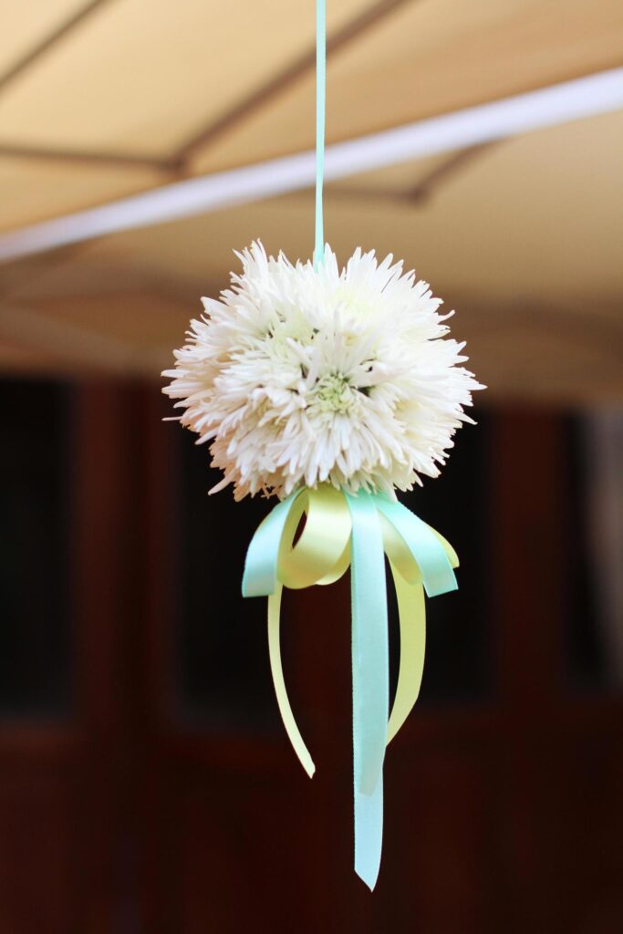 White bouquet flowers with ribbon hanging decoration in wedding ceremony Stock Free