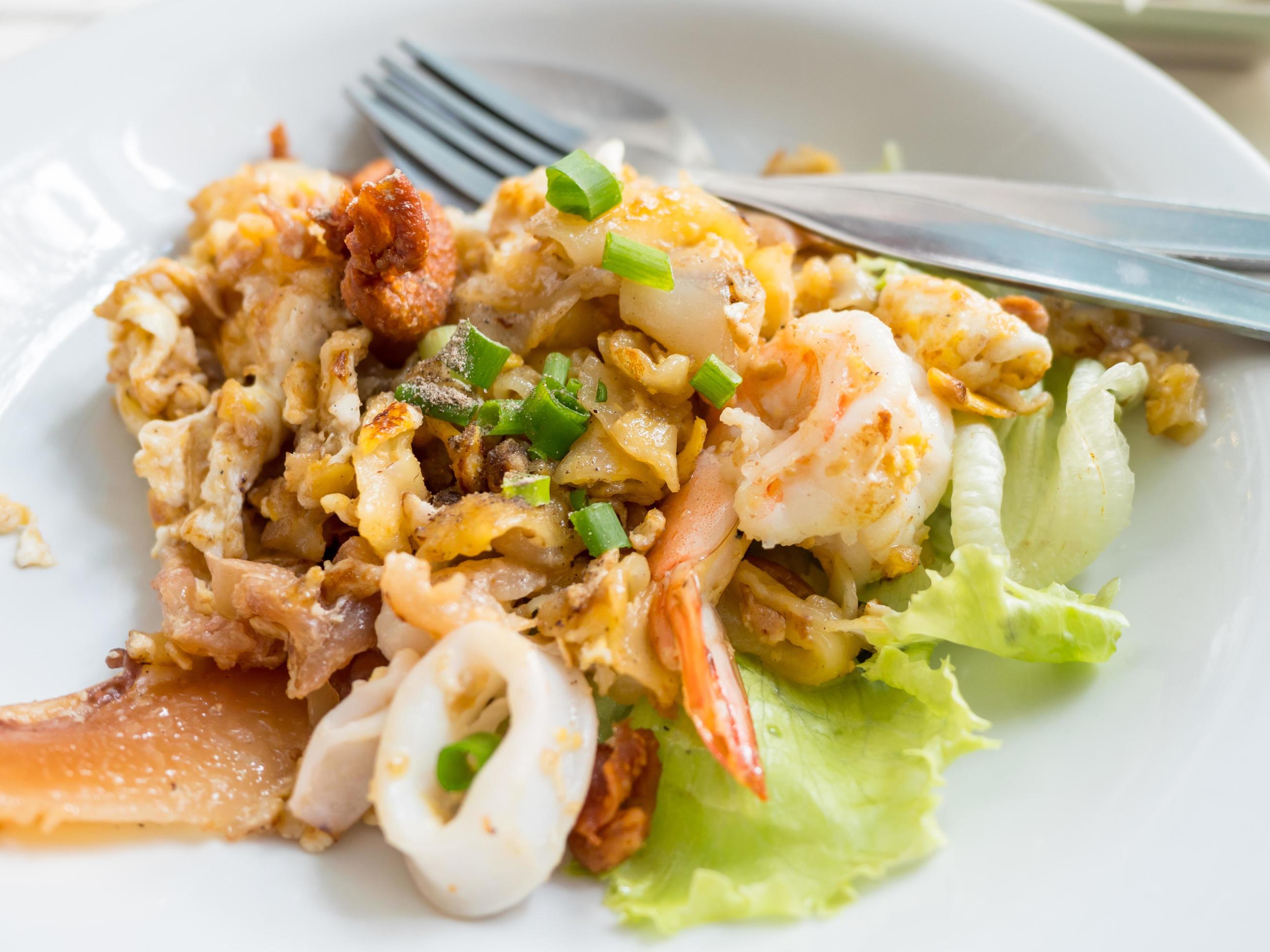 Pad thai or thai food on wood table Stock Free