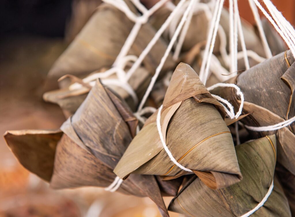 Making zongzi – ingredient of Chinese rice dumpling zongzi making on table at home for Dragon Boat Festival celebration, close up, lifestyle. Stock Free