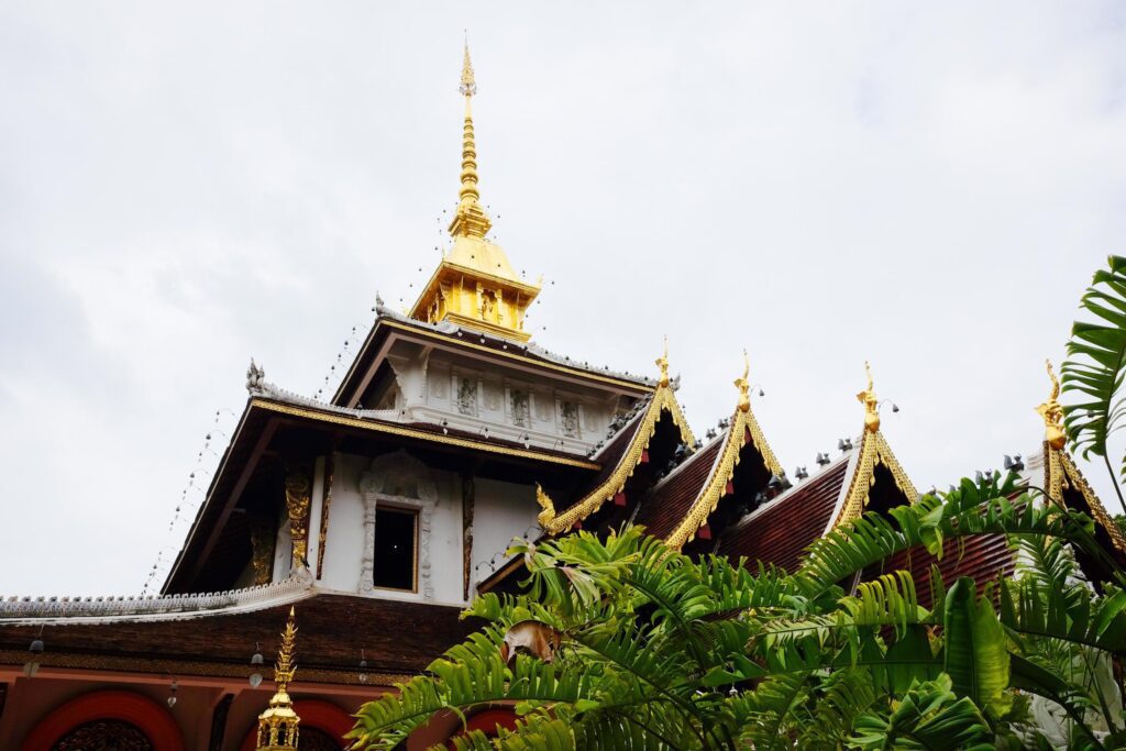 Heritage Golden and white sanctuary and chapel in the temple of lanna style at Chiangmai province, Thailand Stock Free