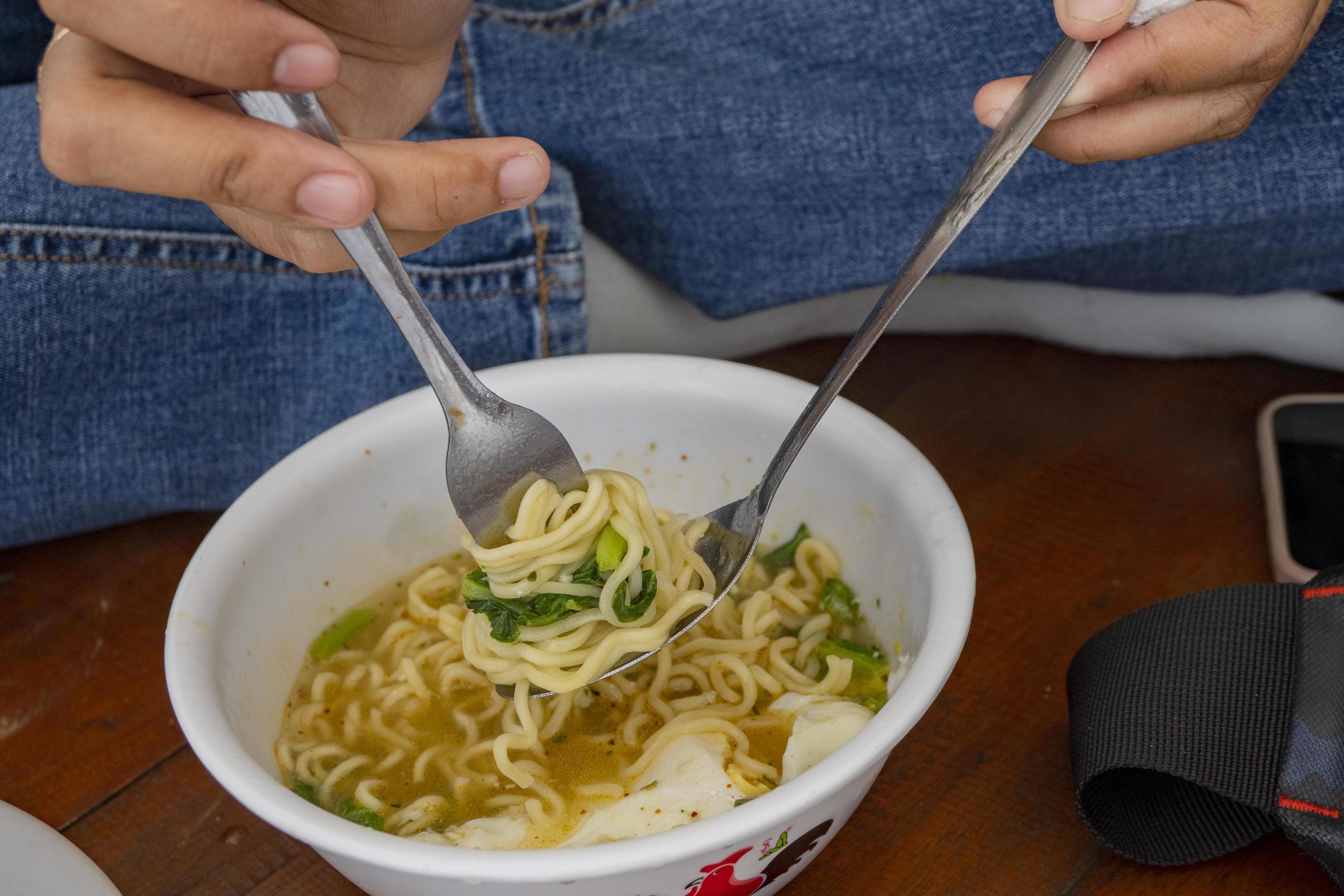 Traditional noodles of Semarang Instant Noodles with eggs. The photo is suitable to use for food background, menu poster and food content media. Stock Free